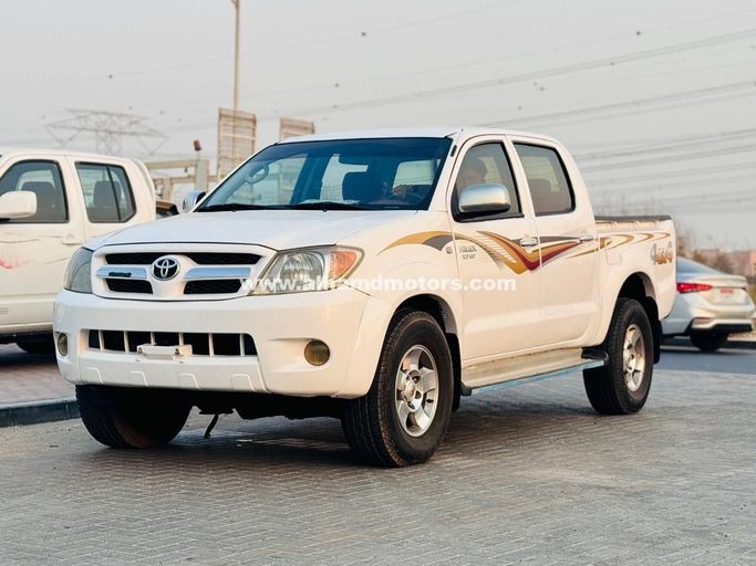 Подержанный Toyota Hilux VII, 2.7 л, 2008 в Дубае от Alhamd Motors Белый цвет. GCC | AUTO.AE