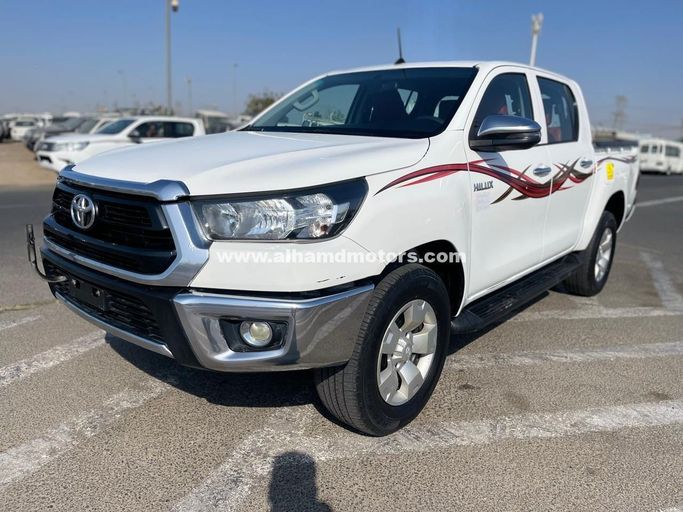 Подержанный Toyota Hilux VIII Рестайлинг, 2.4 л, 2021 в Дубае от Alhamd Motors Белый цвет. GCC | AUTO.AE