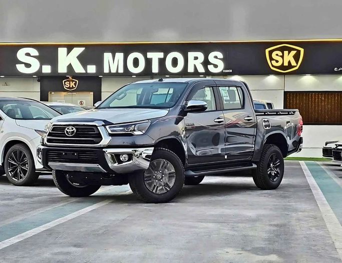 New Toyota Hilux VIII Facelift 2, 2.4 l, 2025 in Dubai by SK Motors, Grey color. GCC Specs | AUTO.AE