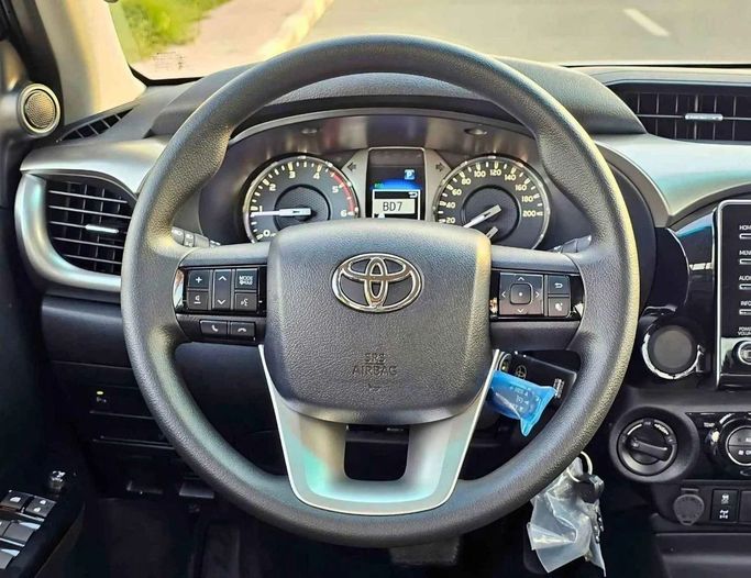 New Toyota Hilux VIII Facelift 2, 2.4 l, 2025 in Dubai by SK Motors, Grey color. GCC Specs | AUTO.AE