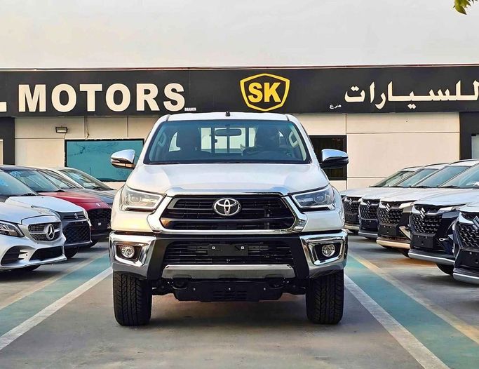 New Toyota Hilux VIII Facelift 2, 2.7 l, 2025 in Dubai by SK Motors, White color. GCC Specs | AUTO.AE