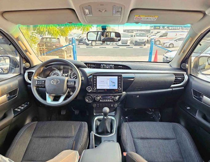 New Toyota Hilux VIII Facelift 2, 2.7 l, 2025 in Dubai by SK Motors, White color. GCC Specs | AUTO.AE
