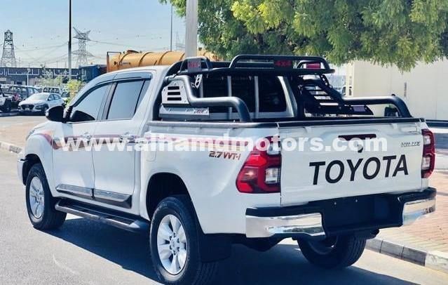 Подержанный Toyota Hilux VIII, 2.7 л, 2020 в Дубае от Alhamd Motors Белый цвет. Other | AUTO.AE