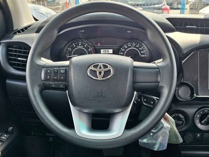 New Toyota Hilux VIII Facelift 2, 2.7 l, 2024 in Dubai by SK Motors, White color. GCC Specs | AUTO.AE