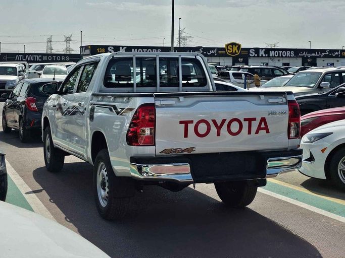 New Toyota Hilux VIII Facelift 2, 2.7 l, 2024 in Dubai by SK Motors, White color. GCC Specs | AUTO.AE