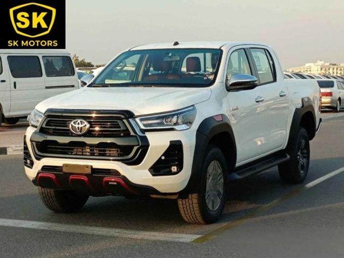 New Toyota Hilux VIII Facelift, 4.0 l, 2024 in Dubai by SK Motors, White color. GCC Specs | AUTO.AE