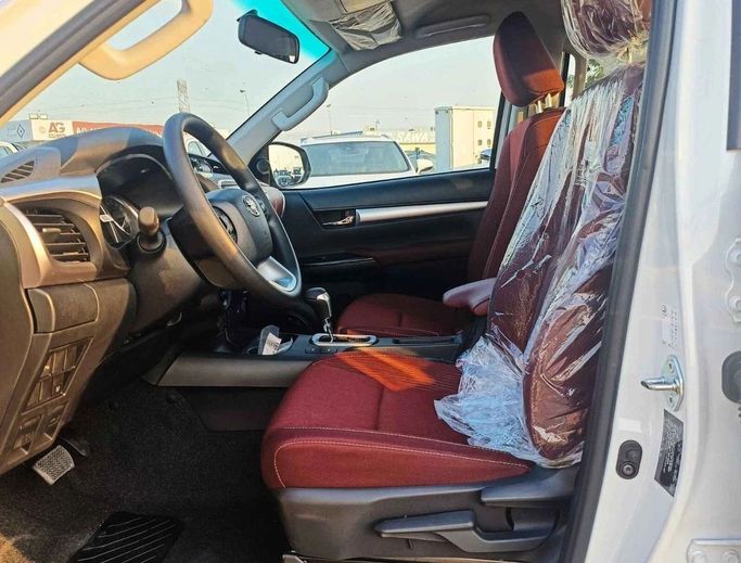 New Toyota Hilux VIII Facelift, 4.0 l, 2024 in Dubai by SK Motors, White color. GCC Specs | AUTO.AE