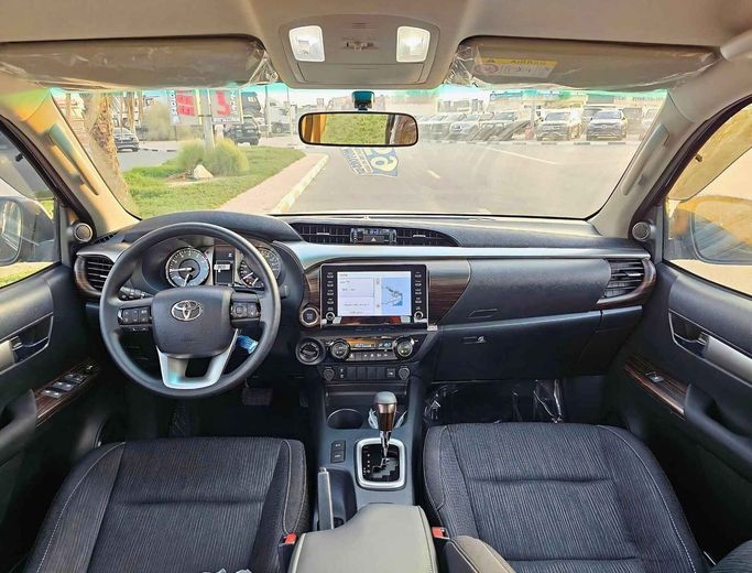 New Toyota Hilux VIII Facelift, 4.0 l, 2024 in Dubai by SK Motors, Black color. GCC Specs | AUTO.AE