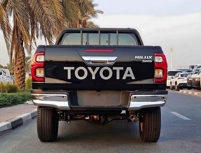 New Toyota Hilux VIII Facelift, 4.0 l, 2024 in Dubai by SK Motors, Black color. GCC Specs | AUTO.AE