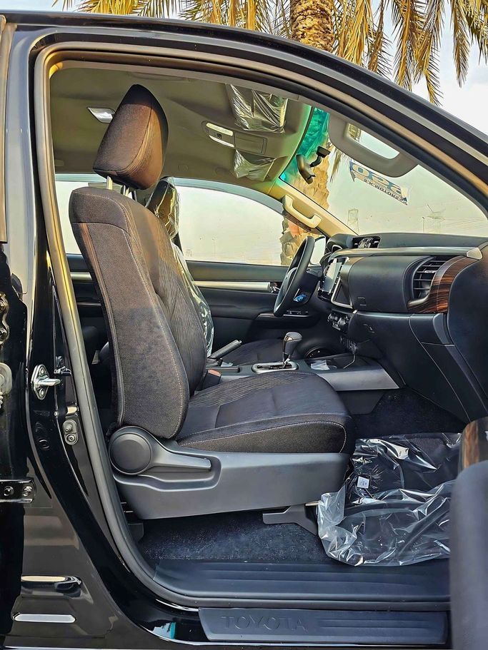 New Toyota Hilux VIII Facelift, 4.0 l, 2024 in Dubai by SK Motors, Black color. GCC Specs | AUTO.AE