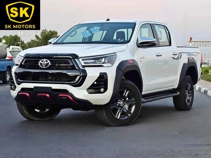 New Toyota Hilux VIII Facelift, 4.0 l, 2024 in Dubai by SK Motors, White color. GCC Specs | AUTO.AE