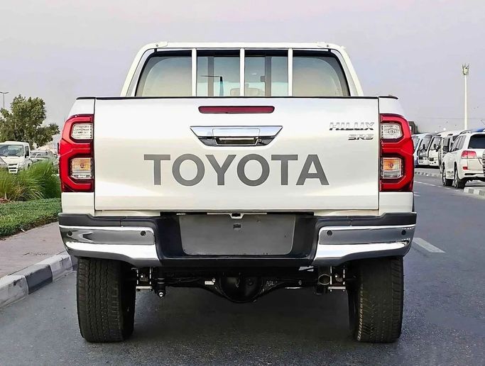 New Toyota Hilux VIII Facelift, 4.0 l, 2024 in Dubai by SK Motors, White color. GCC Specs | AUTO.AE