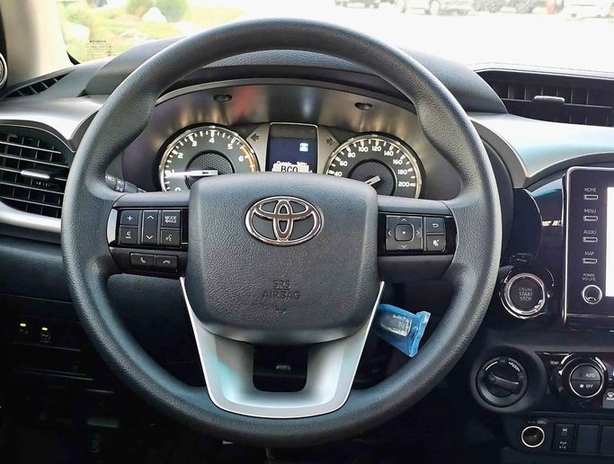 New Toyota Hilux VIII Facelift, 4.0 l, 2024 in Dubai by SK Motors, White color. GCC Specs | AUTO.AE