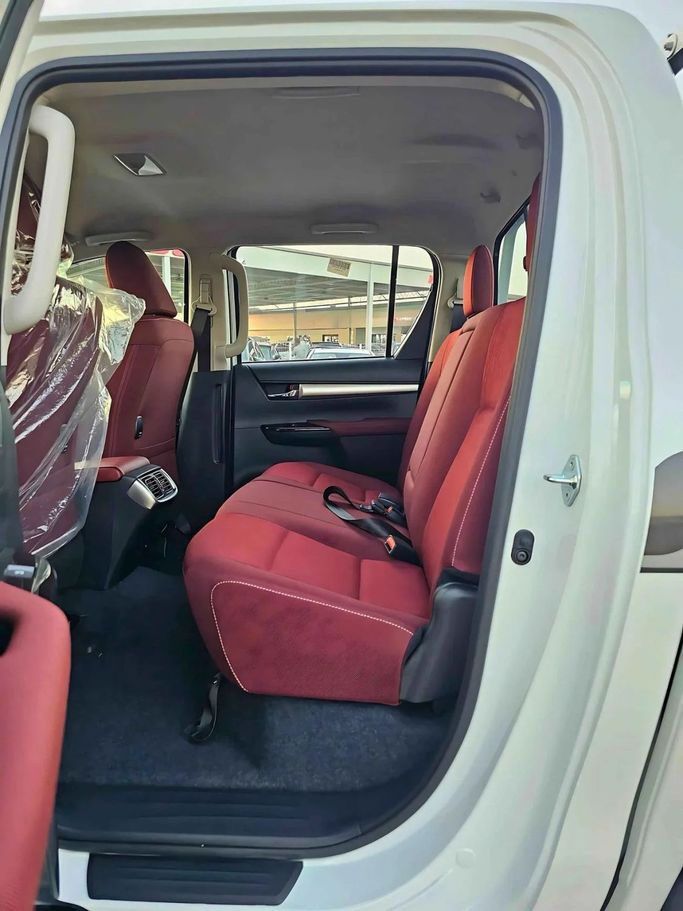 New Toyota Hilux VIII Facelift, 4.0 l, 2024 in Dubai by SK Motors, White color. GCC Specs | AUTO.AE
