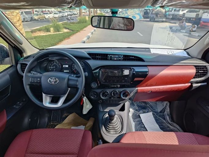 New Toyota Hilux VIII Facelift, 2.7 l, 2024 in Dubai by SK Motors, White color. GCC Specs | AUTO.AE