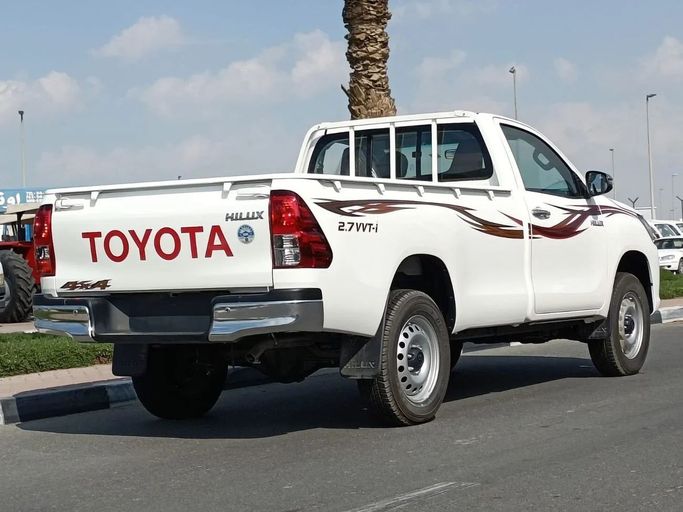 New Toyota Hilux VIII Facelift, 2.7 l, 2024 in Dubai by SK Motors, White color. GCC Specs | AUTO.AE