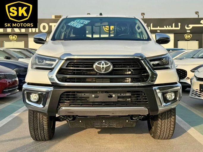 New Toyota Hilux VIII Facelift, 2.7 l, 2025 in Dubai by SK Motors, White color. GCC Specs | AUTO.AE