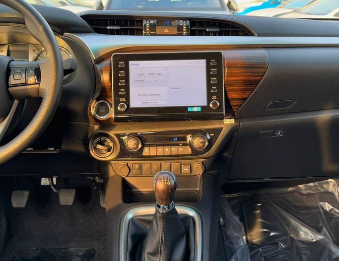 New Toyota Hilux VIII Facelift, 2.7 l, 2025 in Dubai by SK Motors, White color. GCC Specs | AUTO.AE