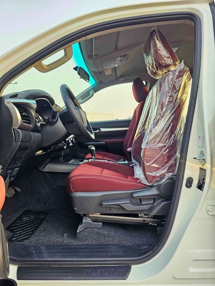 New Toyota Hilux VIII Facelift 2, 2.7 l, 2025 in Dubai by SK Motors, White color. GCC Specs | AUTO.AE