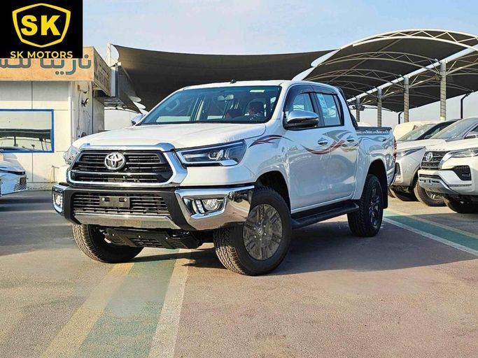 New Toyota Hilux VIII Facelift, 2.7 l, 2025 in Dubai by SK Motors, White color. GCC Specs | AUTO.AE