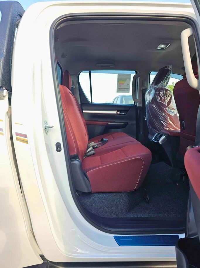 New Toyota Hilux VIII Facelift, 2.7 l, 2025 in Dubai by SK Motors, White color. GCC Specs | AUTO.AE