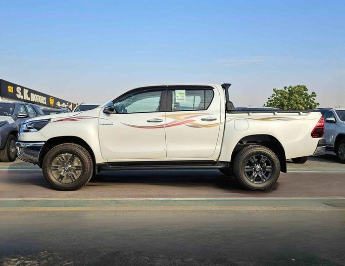 New Toyota Hilux VIII Facelift, 2.7 l, 2025 in Dubai by SK Motors, White color. GCC Specs | AUTO.AE