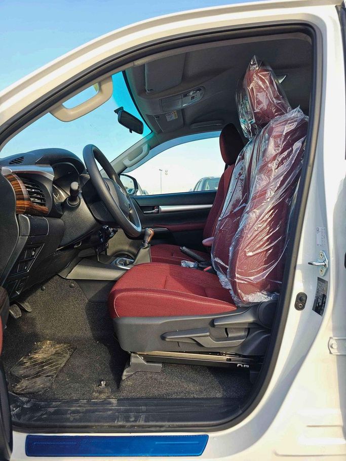 New Toyota Hilux VIII Facelift, 2.7 l, 2025 in Dubai by SK Motors, White color. GCC Specs | AUTO.AE