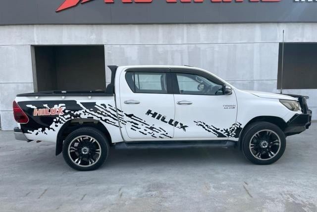 Used Toyota Hilux VIII, 2.8 l, 2019 in Dubai by Alhamd Motors, White color. Other | AUTO.AE