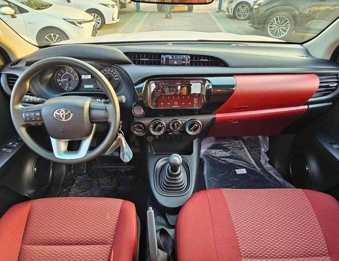 New Toyota Hilux VIII Facelift, 2.7 l, 2025 in Dubai by SK Motors, White color. GCC Specs | AUTO.AE