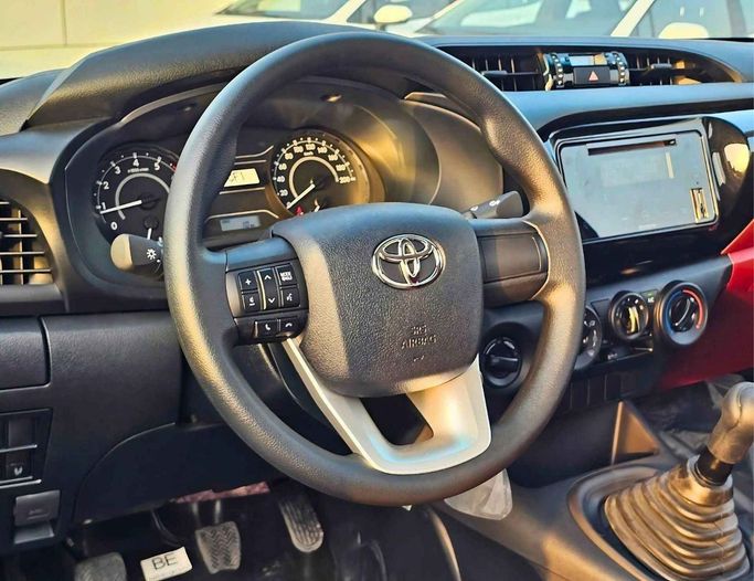 New Toyota Hilux VIII Facelift, 2.7 l, 2025 in Dubai by SK Motors, White color. GCC Specs | AUTO.AE
