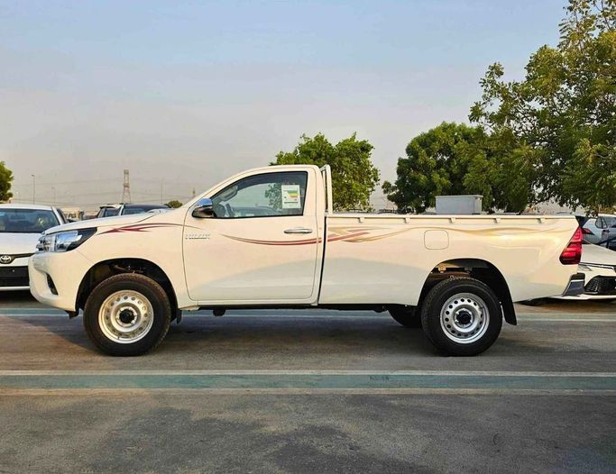 New Toyota Hilux VIII Facelift, 2.7 l, 2025 in Dubai by SK Motors, White color. GCC Specs | AUTO.AE
