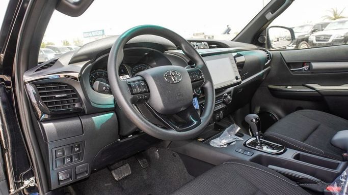New Toyota Hilux VIII Facelift, 4.0 l, 2025 in Dubai by Najem Motors, Black color. GCC Specs | AUTO.AE