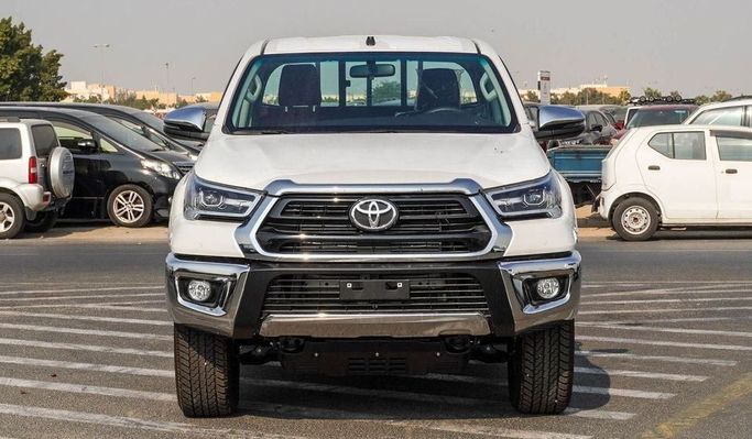 Новый Toyota Hilux VIII Рестайлинг, 2.4 л, 2025 в Дубае от Najem Motors Белый цвет. GCC | AUTO.AE