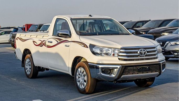 New Toyota Hilux Extra Cab VIII Facelift, 2.4 l, 2024 in Dubai by Najem Motors, White color. GCC Specs | AUTO.AE