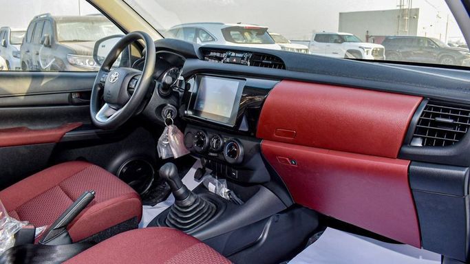 New Toyota Hilux Extra Cab VIII Facelift, 2.4 l, 2024 in Dubai by Najem Motors, White color. GCC Specs | AUTO.AE