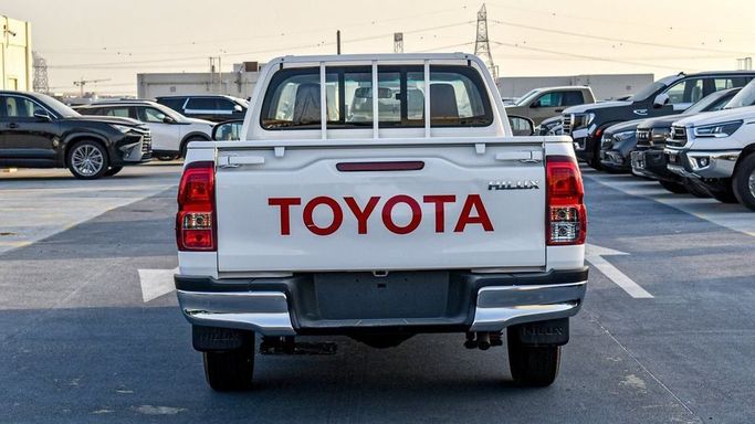 New Toyota Hilux Extra Cab VIII Facelift, 2.4 l, 2024 in Dubai by Najem Motors, White color. GCC Specs | AUTO.AE
