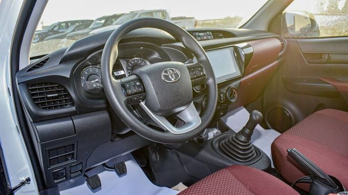 New Toyota Hilux Extra Cab VIII Facelift, 2.4 l, 2024 in Dubai by Najem Motors, White color. GCC Specs | AUTO.AE