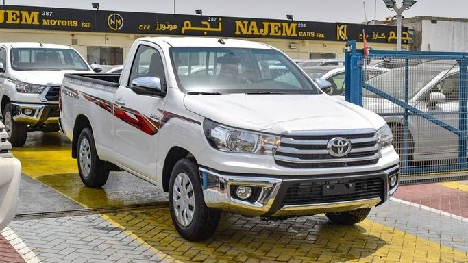 New Toyota Hilux Extra Cab VIII Facelift, 2.4 l, 2024 in Dubai by Najem Motors, White color. GCC Specs | AUTO.AE