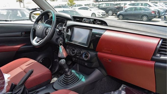 New Toyota Hilux Extra Cab VIII Facelift, 2.4 l, 2024 in Dubai by Najem Motors, White color. GCC Specs | AUTO.AE