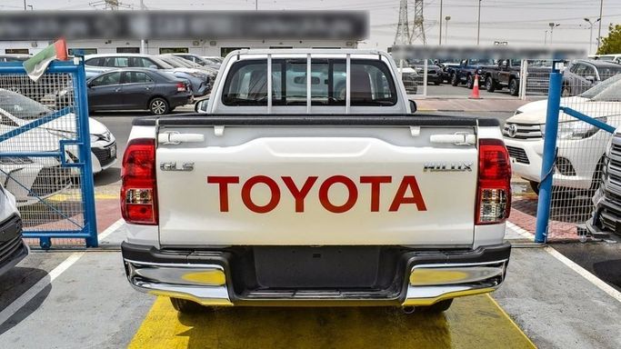 New Toyota Hilux Extra Cab VIII Facelift, 2.4 l, 2024 in Dubai by Najem Motors, White color. GCC Specs | AUTO.AE