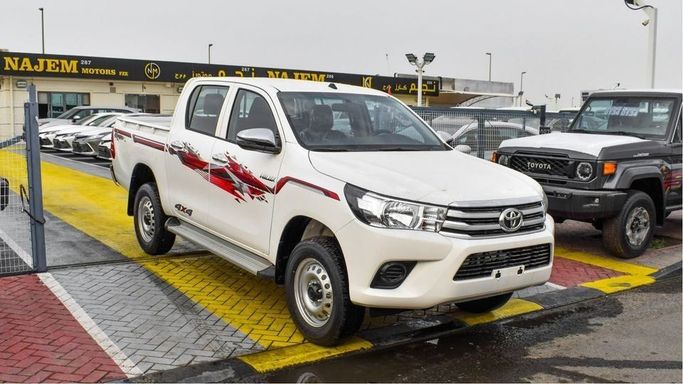 New Toyota Hilux VIII Facelift 2, 2.7 l, 2024 in Dubai by Najem Motors, White color. GCC Specs | AUTO.AE