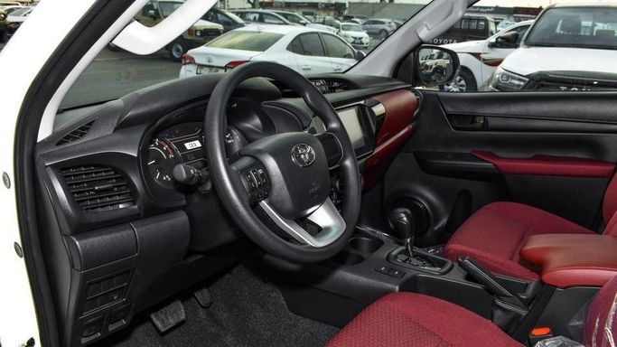 New Toyota Hilux VIII Facelift 2, 2.7 l, 2024 in Dubai by Najem Motors, White color. GCC Specs | AUTO.AE