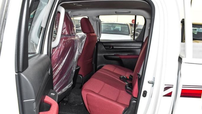 New Toyota Hilux VIII Facelift 2, 2.7 l, 2024 in Dubai by Najem Motors, White color. GCC Specs | AUTO.AE