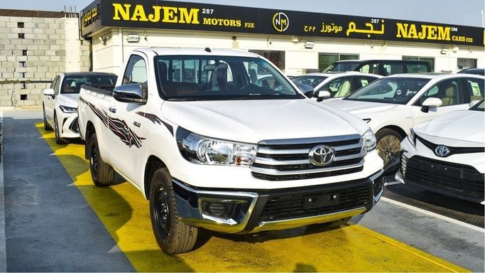 New Toyota Hilux Extra Cab VIII Facelift, 2.4 l, 2024 in Dubai by Najem Motors, White color. GCC Specs | AUTO.AE