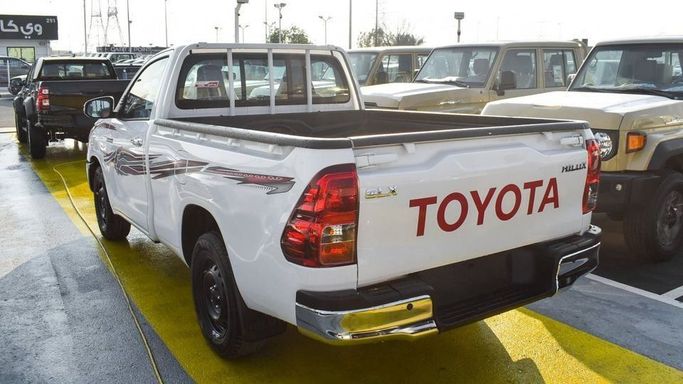 New Toyota Hilux Extra Cab VIII Facelift, 2.4 l, 2024 in Dubai by Najem Motors, White color. GCC Specs | AUTO.AE