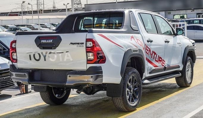 New Toyota Hilux VIII Facelift, 2.7 l, 2023 in Dubai by Najem Motors, White color. GCC Specs | AUTO.AE