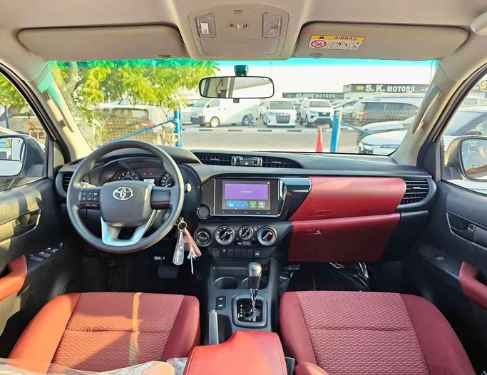 New Toyota Hilux VIII Facelift 2, 2.7 l, 2025 in Dubai by SK Motors, White color. GCC Specs | AUTO.AE