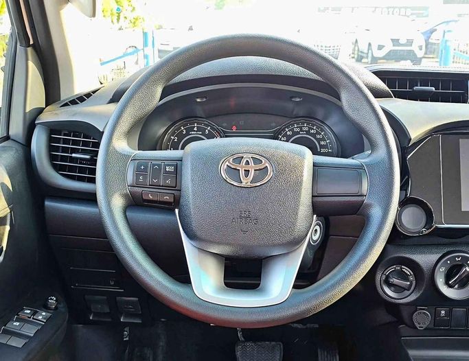 New Toyota Hilux VIII Facelift 2, 2.7 l, 2025 in Dubai by SK Motors, White color. GCC Specs | AUTO.AE
