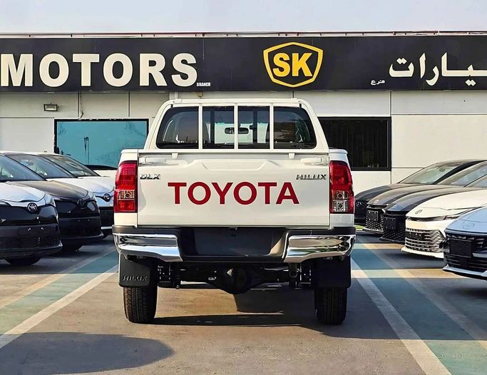 New Toyota Hilux VIII Facelift 2, 2.7 l, 2025 in Dubai by SK Motors, White color. GCC Specs | AUTO.AE