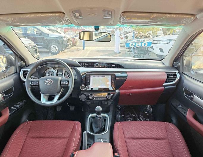 New Toyota Hilux VIII Facelift 2, 2.7 l, 2024 in Dubai by SK Motors, White color. GCC Specs | AUTO.AE